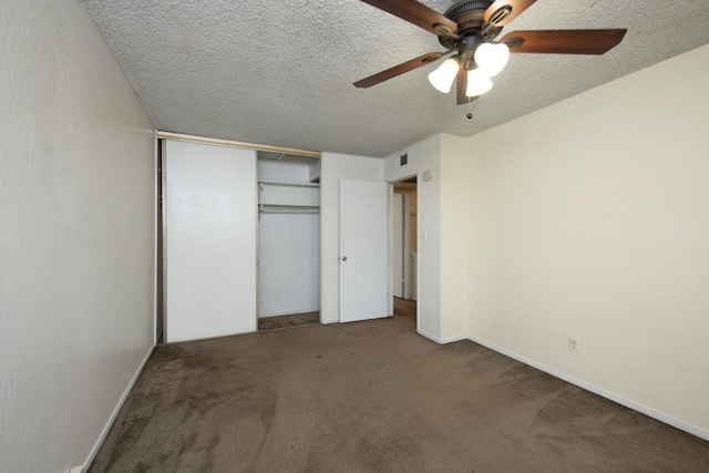 unfurnished bedroom with a ceiling fan, visible vents, a closet, a textured ceiling, and carpet flooring