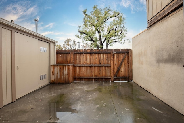 view of patio featuring fence