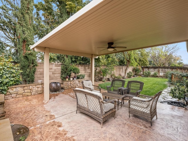 view of patio / terrace with ceiling fan, an outdoor living space, and a fenced backyard