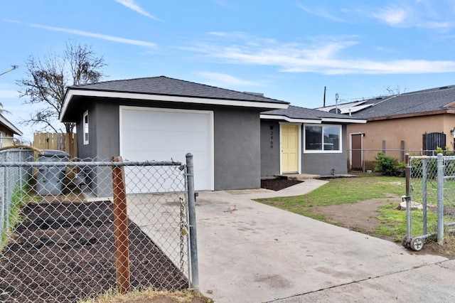 view of front of house with fence, a shingled roof, stucco siding, concrete driveway, and a garage