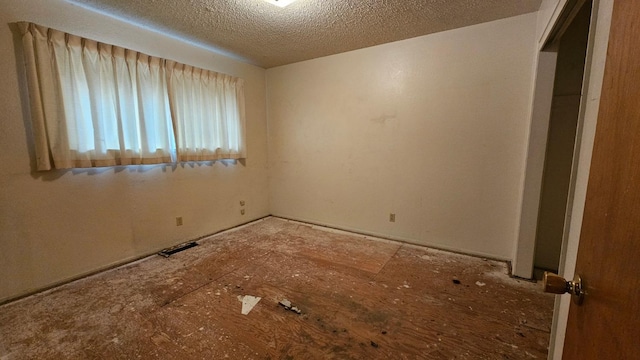 unfurnished bedroom featuring a textured ceiling