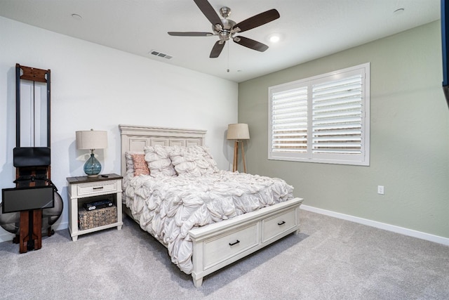 bedroom with visible vents, baseboards, a ceiling fan, and carpet flooring