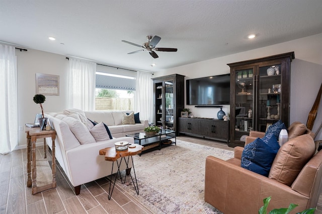 living room featuring ceiling fan, recessed lighting, and wood finish floors