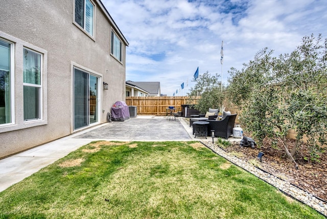 view of yard featuring cooling unit, an outdoor hangout area, fence, and a patio area