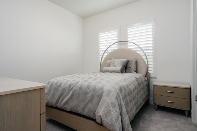 bedroom with light colored carpet