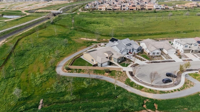 birds eye view of property with a residential view