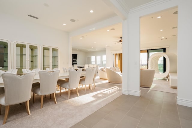 dining room featuring a ceiling fan, visible vents, light tile patterned flooring, recessed lighting, and crown molding