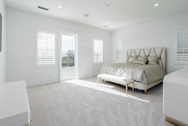 bedroom featuring visible vents, recessed lighting, carpet flooring, baseboards, and access to exterior