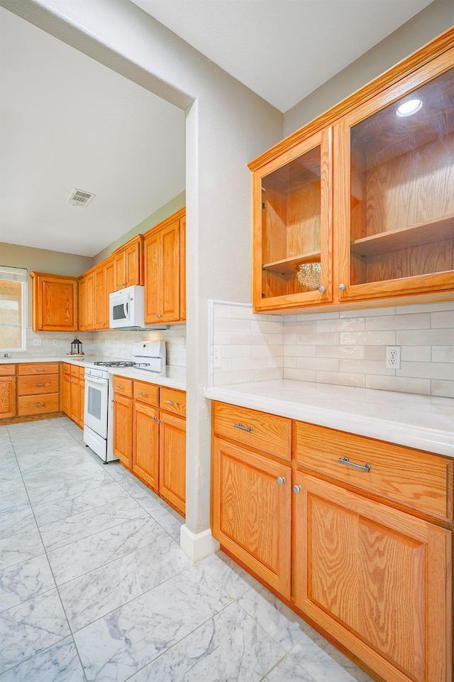 kitchen featuring open shelves, white appliances, marble finish floor, and light countertops