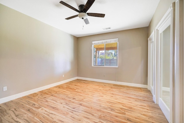 unfurnished bedroom with a ceiling fan, light wood-style flooring, baseboards, and visible vents