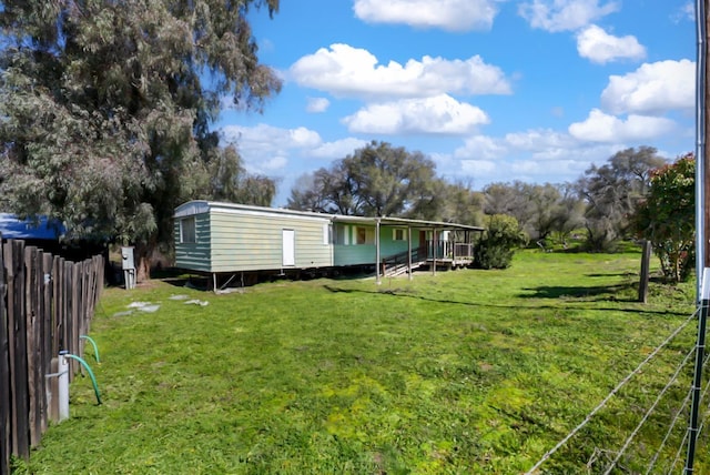 view of yard with fence