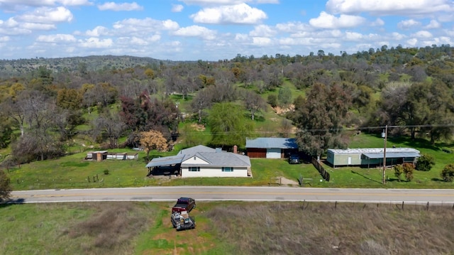 drone / aerial view with a view of trees