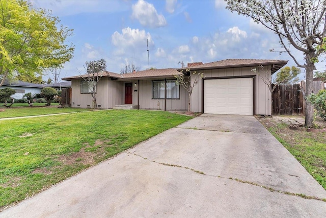 ranch-style home with driveway, a front lawn, fence, board and batten siding, and a garage