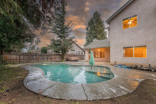 view of swimming pool with a fenced in pool, a patio, and a fenced backyard