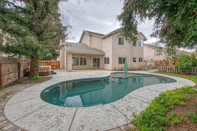 view of pool featuring a patio area, a fenced in pool, and a fenced backyard