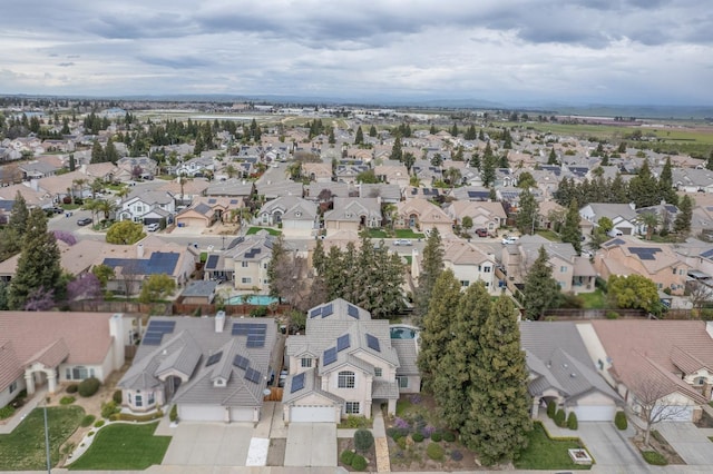 birds eye view of property with a residential view