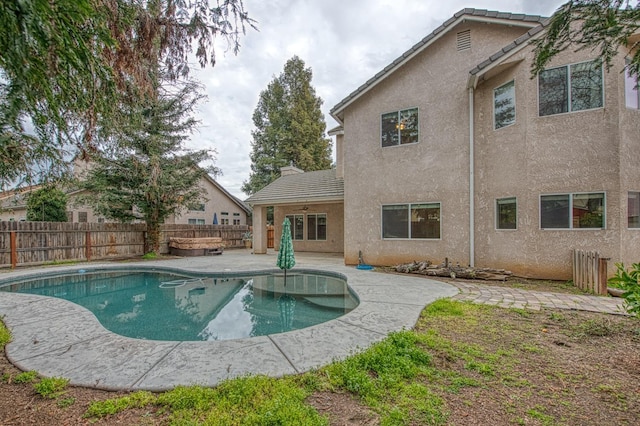 view of swimming pool featuring a patio area, a fenced in pool, and a fenced backyard