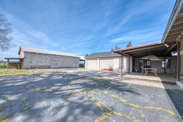 exterior space with a detached garage