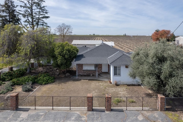 birds eye view of property featuring a rural view