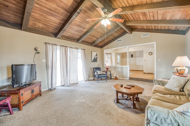 living area featuring visible vents, lofted ceiling with beams, a ceiling fan, and carpet floors