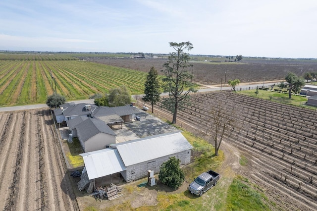 birds eye view of property with a rural view