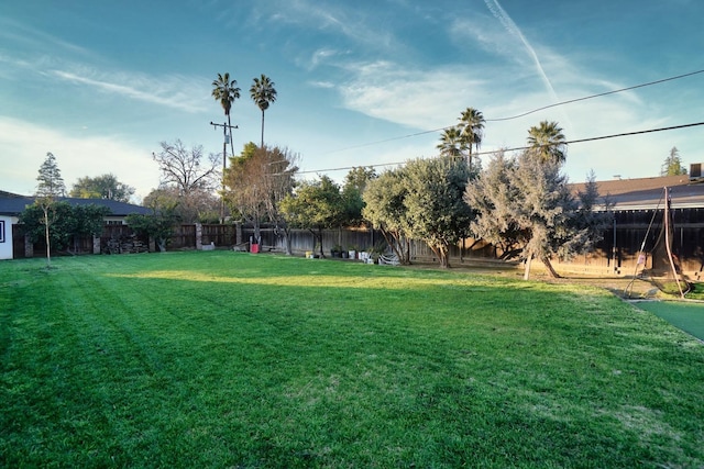 view of yard with a fenced backyard