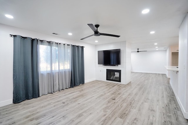 unfurnished living room featuring recessed lighting, a ceiling fan, and visible vents