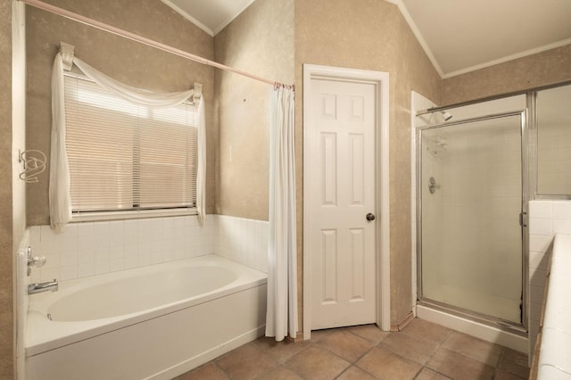 full bath featuring tile patterned floors, a stall shower, a garden tub, and ornamental molding