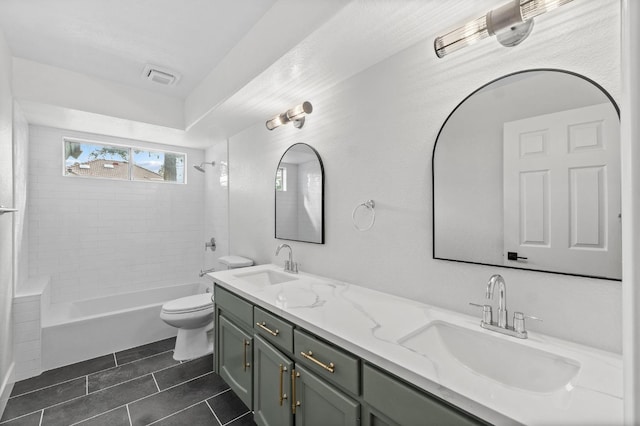 full bath featuring tile patterned flooring, visible vents, toilet, and a sink