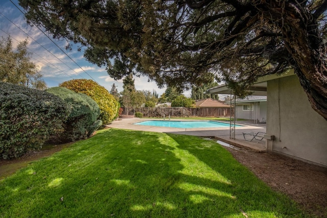 view of yard with a patio area, a fenced backyard, and a fenced in pool