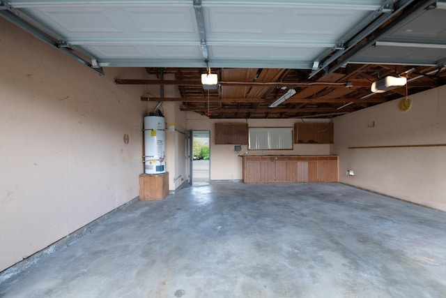 garage featuring water heater and a garage door opener