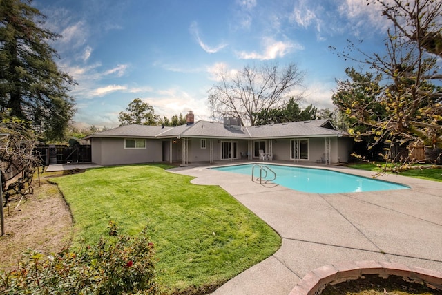 view of pool with a yard, a patio area, a fenced in pool, and a fenced backyard