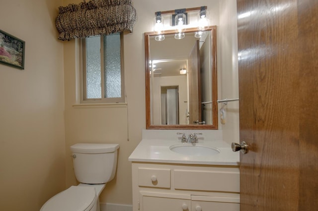 half bathroom with toilet and vanity