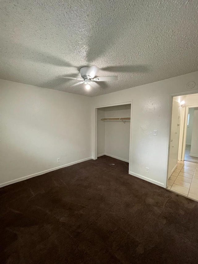 4421 E Hedges Ave, Fresno, CA 93703 - unfurnished bedroom with a closet, a ceiling fan, carpet, baseboards, and a textured ceiling