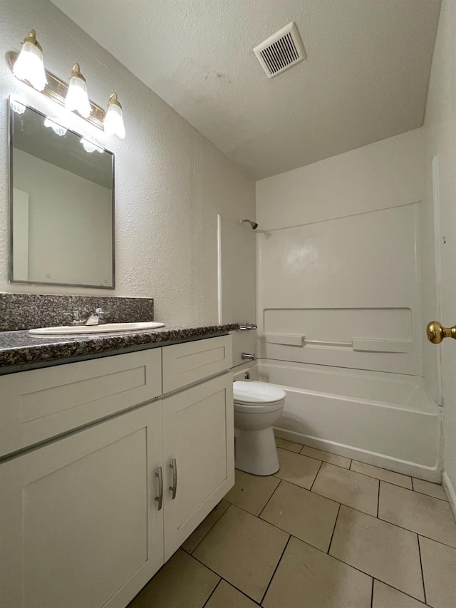4421 E Hedges Ave, Fresno, CA 93703 - full bathroom featuring shower / tub combination, a textured ceiling, visible vents, toilet, and vanity