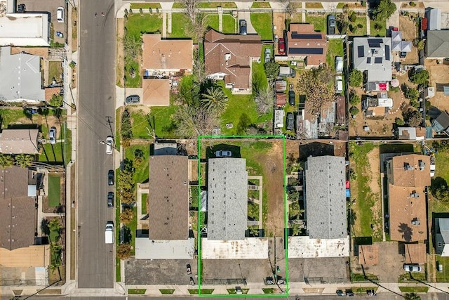 birds eye view of property with a residential view