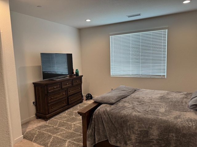 bedroom with recessed lighting, baseboards, carpet floors, and visible vents