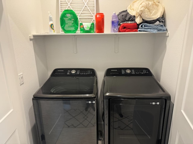 laundry room with washing machine and dryer