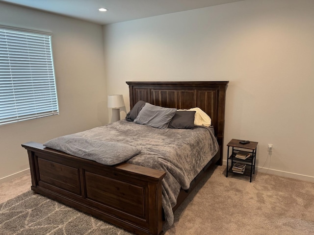 carpeted bedroom with recessed lighting and baseboards