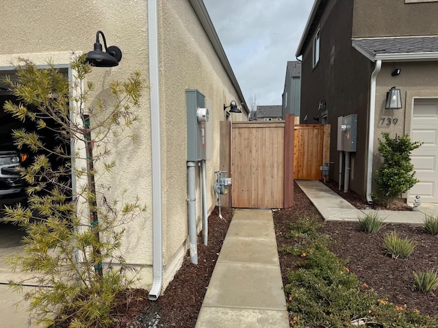 view of home's exterior with a garage and stucco siding