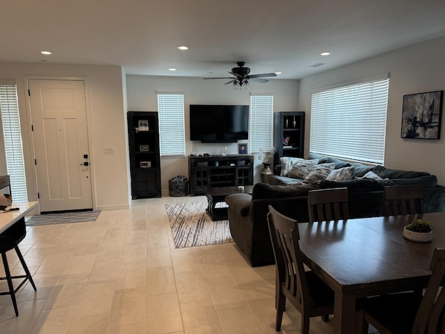 living room featuring recessed lighting, a ceiling fan, and visible vents