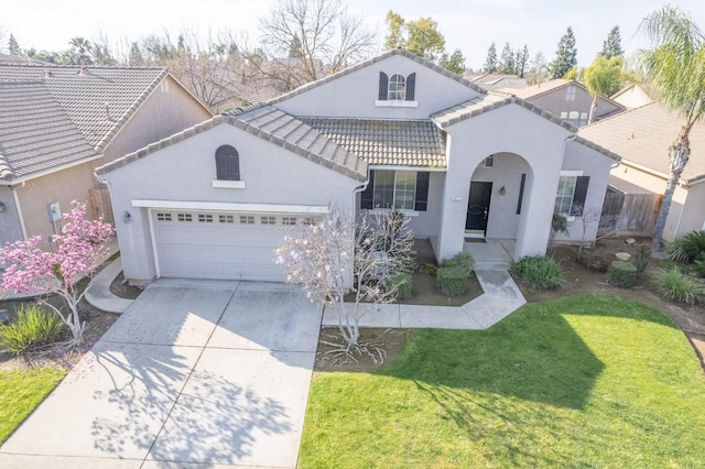 mediterranean / spanish-style home featuring stucco siding, concrete driveway, a front lawn, a garage, and a tile roof