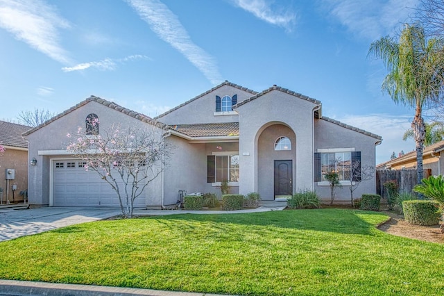 mediterranean / spanish-style house featuring a front yard, stucco siding, concrete driveway, a garage, and a tile roof