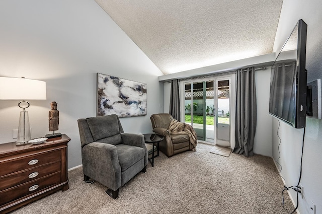 living area with lofted ceiling, a textured ceiling, and carpet flooring