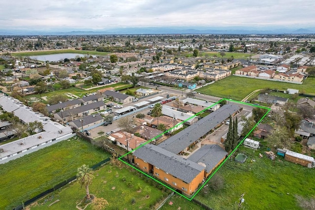 birds eye view of property with a residential view and a water view