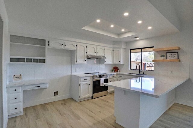 1010 S Clovis Ave Unit 101, Fresno, CA 93727 - kitchen featuring stainless steel electric range oven, a sink, a peninsula, open shelves, and light wood-style floors