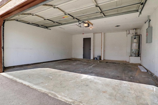 garage with strapped water heater, electric panel, and a garage door opener