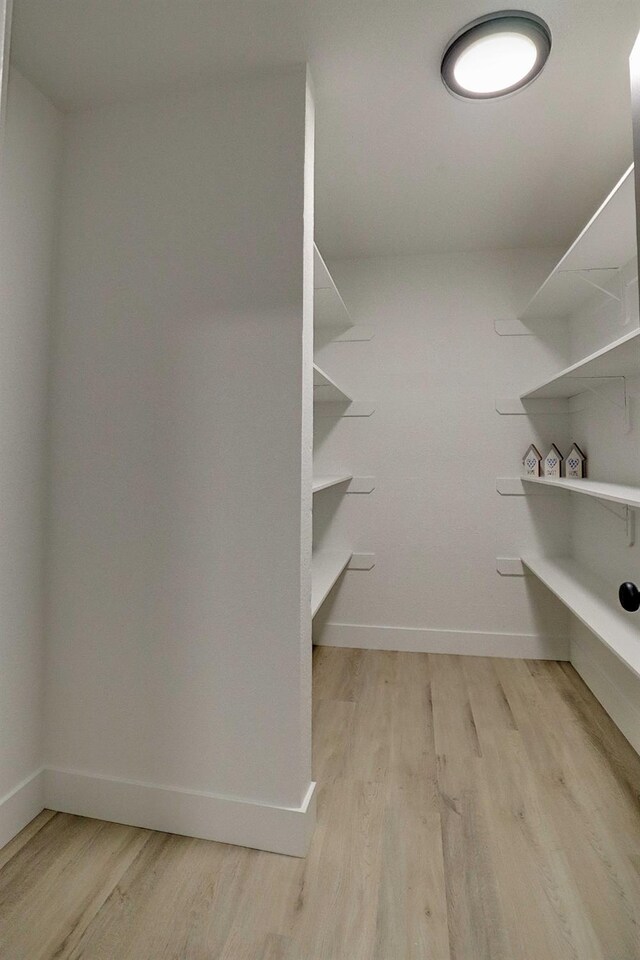 1010 S Clovis Ave Unit 101, Fresno, CA 93727 - walk in closet featuring light wood finished floors