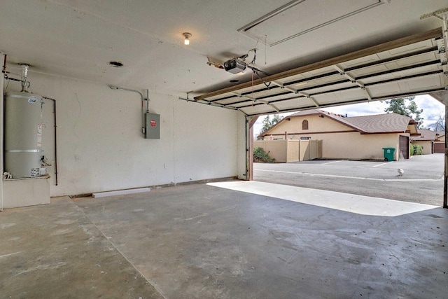 garage with electric panel, a garage door opener, and water heater