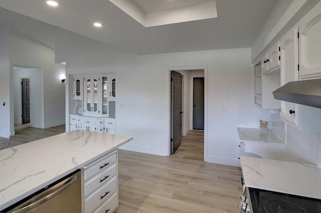 kitchen featuring light wood-type flooring, light stone counters, recessed lighting, white cabinets, and stainless steel appliances